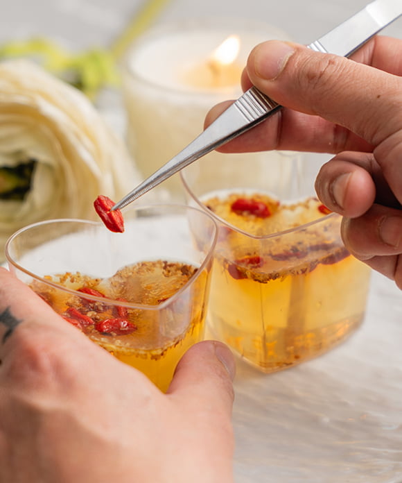 Placing goji berries on jelly
