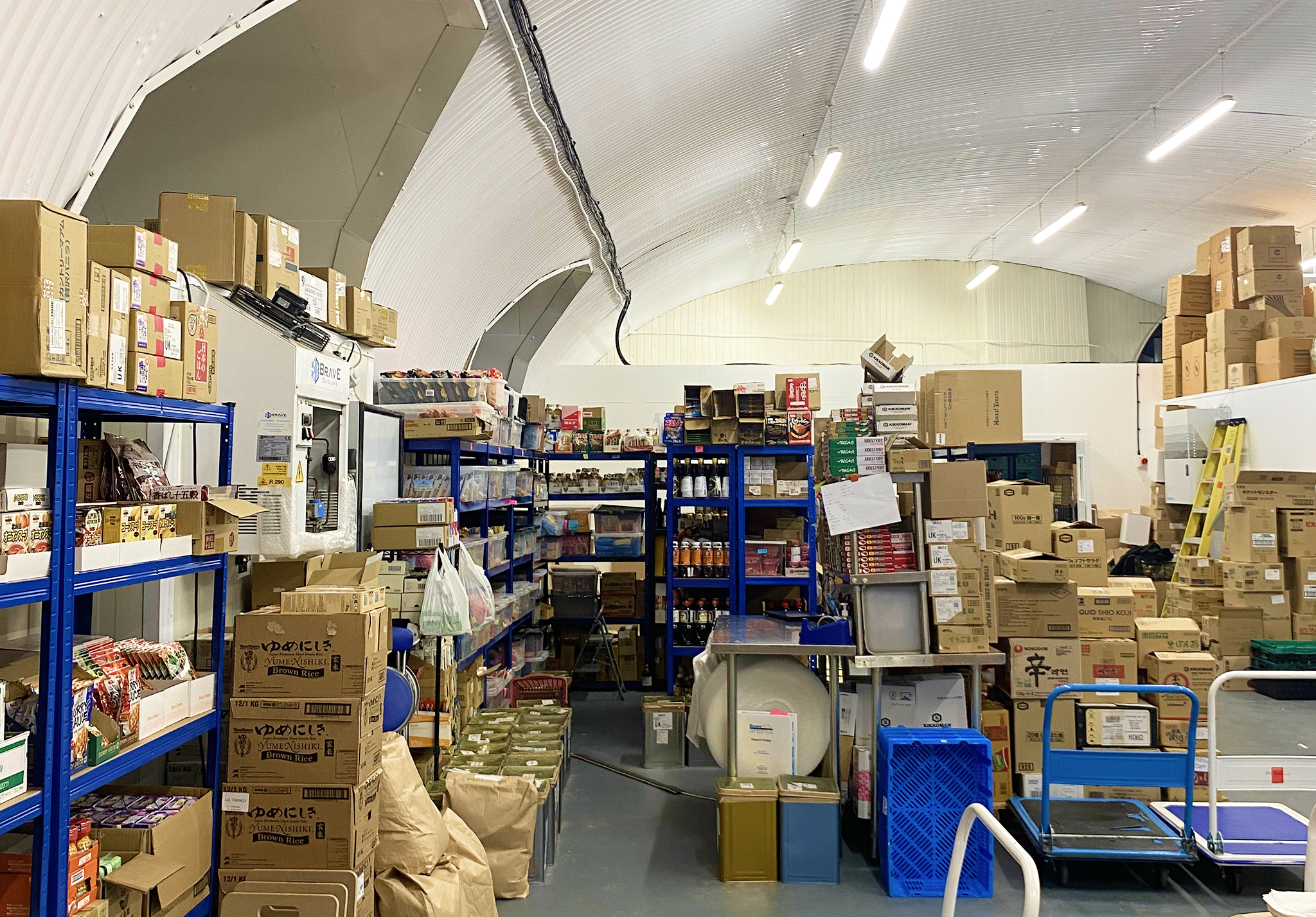 Inside the WASO warehouse with shelves of Japanese food products and packaging